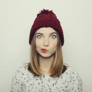 Portrait of an attractive young girl in winter clothes