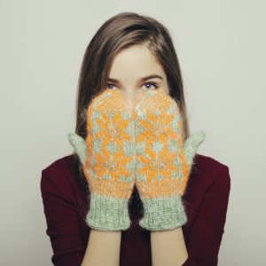 Portrait of an attractive young girl in winter clothes